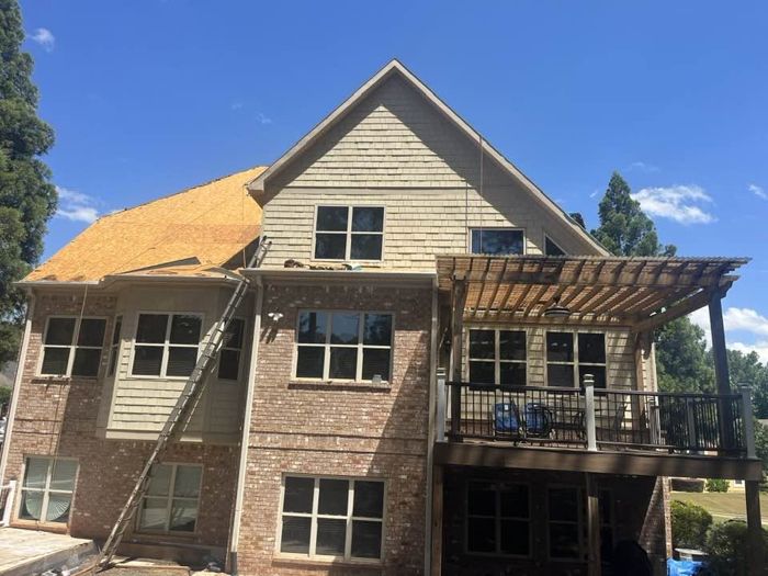 Roof decking exposed during a re-roof on a two-story home